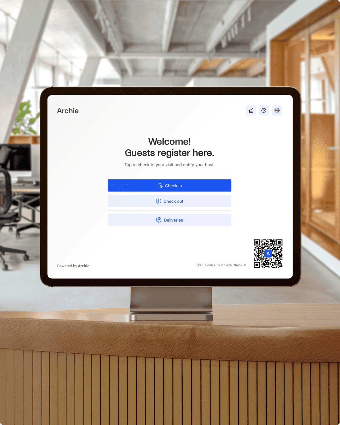 A tablet device displaying a welcome screen for guest registration with Archie Visitors app at a coworking space. The screen prompts guests to check-in, check-out, or view deliveries, and includes a QR code for touchless check-in.